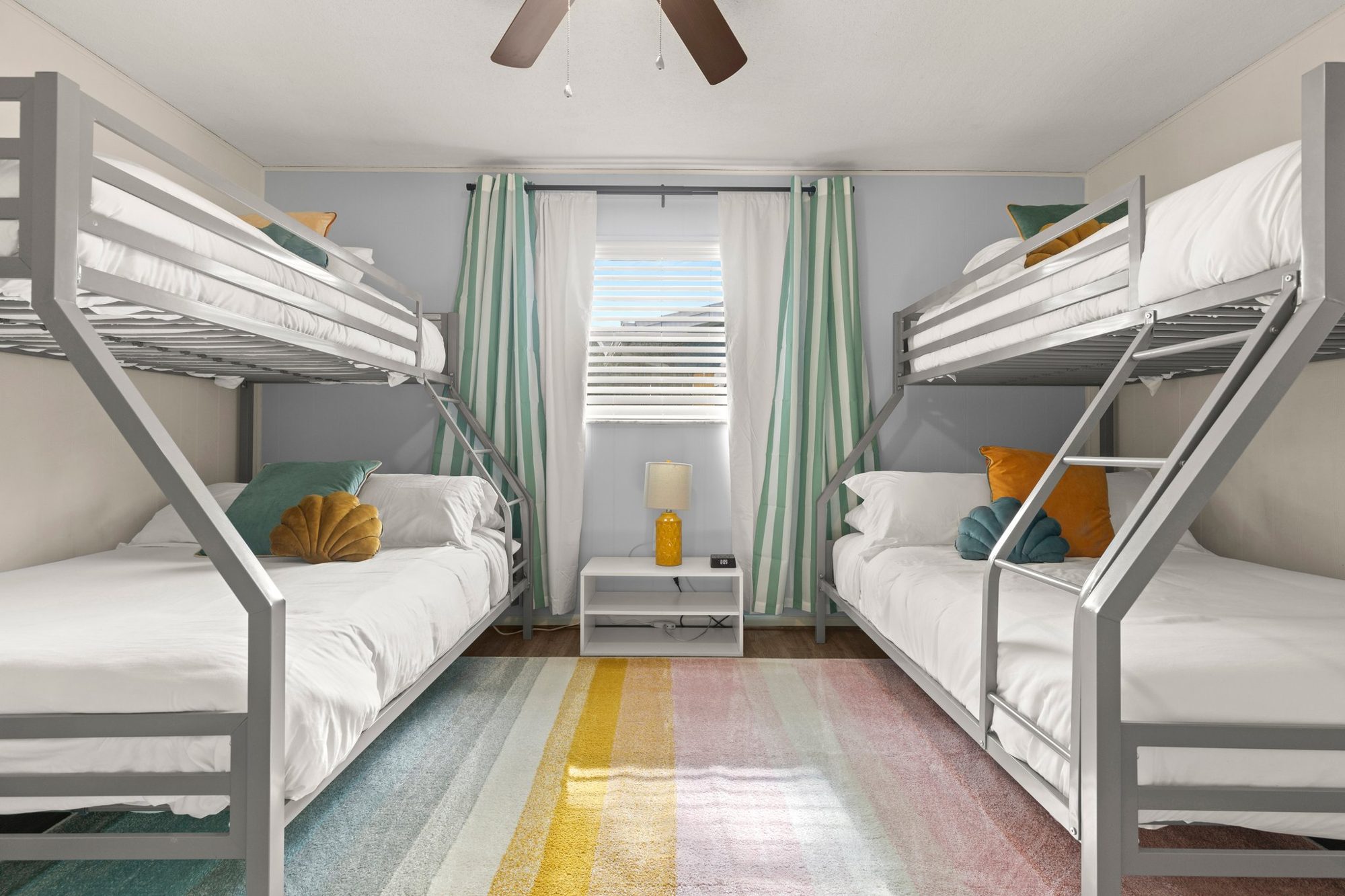 Kids' bunk room with two bunk beds at Sunset Escape